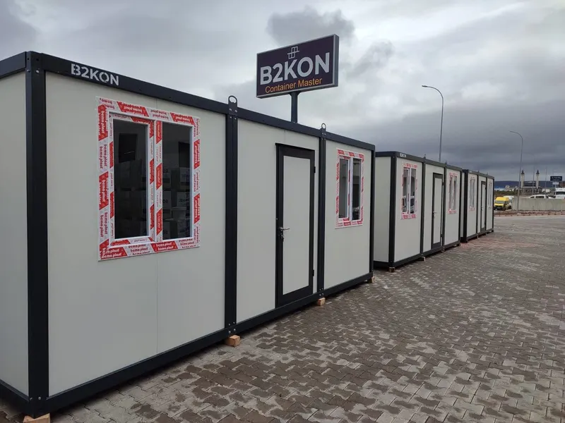 A row of B2KON mobile units set up as one facility